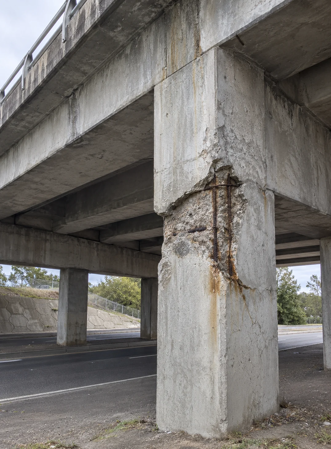 Bridge & Infrastructure Concrete Cancer Repairs Sydney 24 Damaged reinforced-concrete pier and overhead bridge soffit at an urban road overpass
