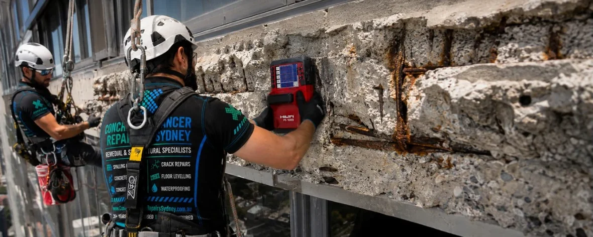 Rope-access concrete cancer inspection on a major Sydney CBD commercial tower façade