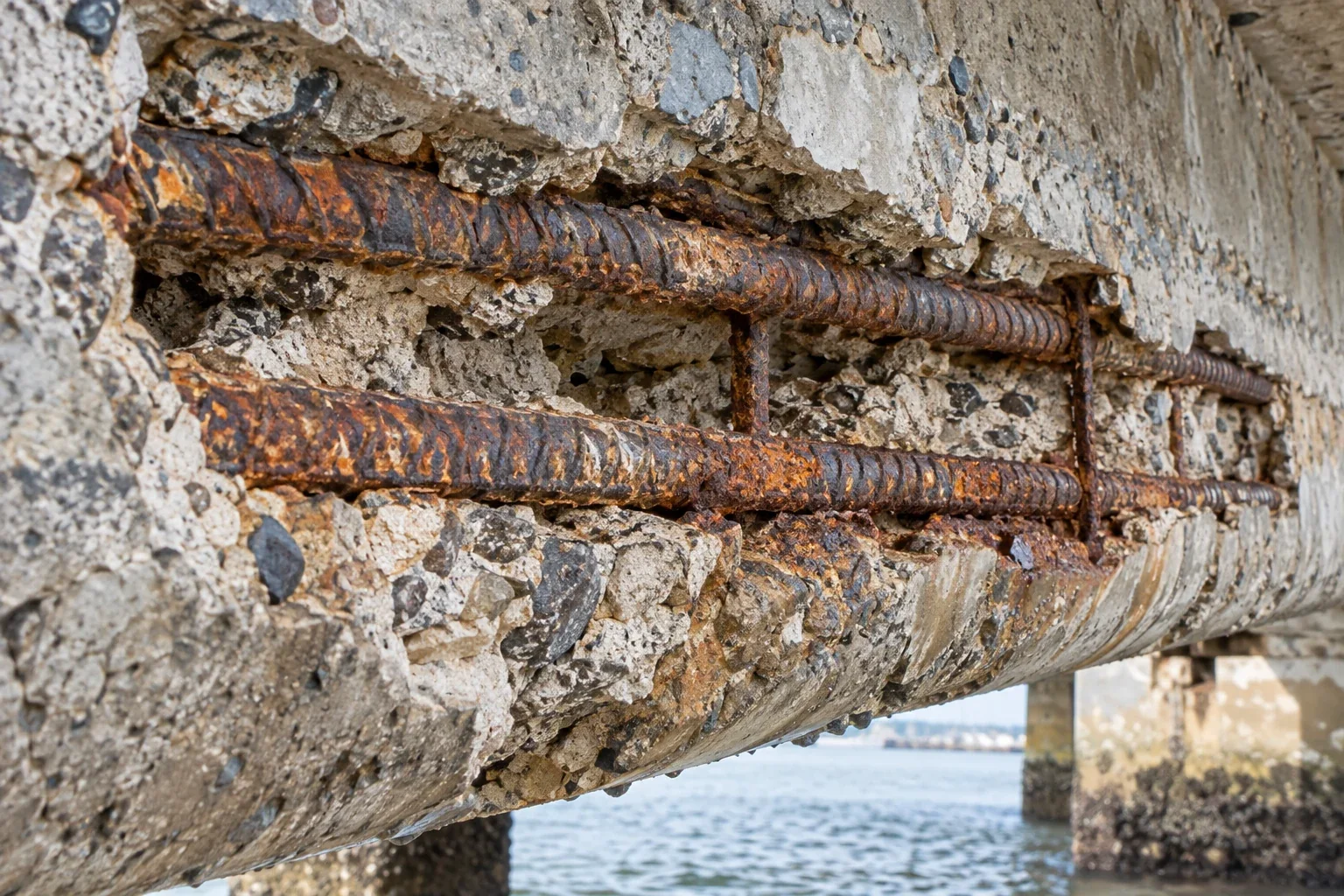 Exposed reinforcement in weathered marine concrete