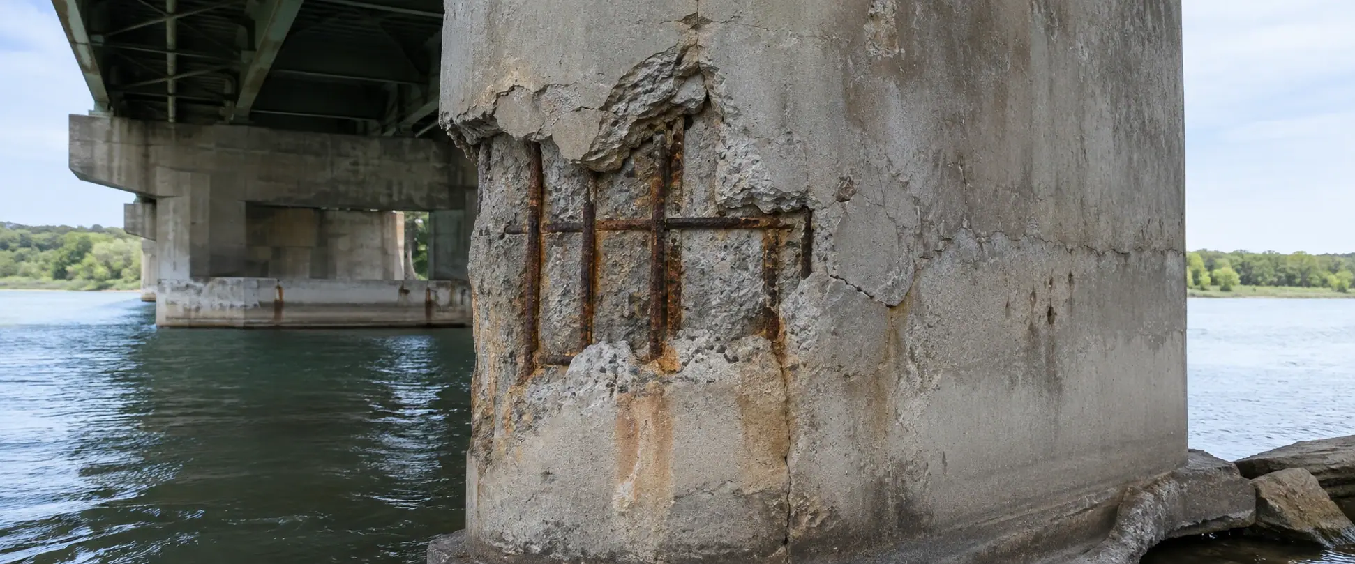 Illustrative BEFORE concept: spalling, cracking and reinforcement corrosion in a bridge pier exposed to tidal water and salt-laden air.